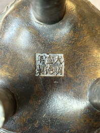 A fine Chinese bronze censer and cover with a Buddhist lion, 'ding 鼎', Xuande Mark, Ming