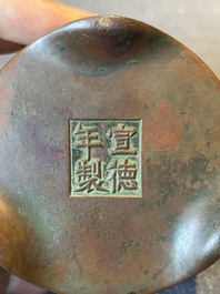 A small Chinese bronze cylindric tripod censer, Xuande mark, Ming