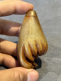 A rare Chinese rhinoceros horn snuff bottle in the shape of a Buddha hand, 19th C.