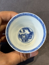 A Chinese blue and white 'erotic' cup and saucer, Kangxi