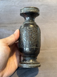 A Chinese bronze vase and a Taoist figure-shaped incense burner, Ming
