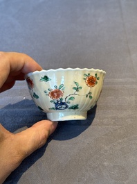 A pair of Chinese famille verte cafe-au-lait-ground cups and saucers, Kangxi