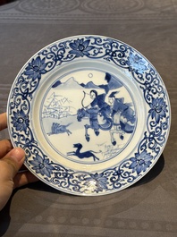 A pair of Chinese blue and white 'hunting scene' plates, Qi Yu Bao Ding Zhi Zhen 奇玉寶鼎之珍 mark, Kangxi