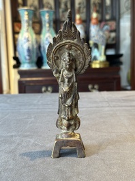 A rare Chinese gilt bronze standing Buddha with aureola and inscription, Northern Wei, dated 441