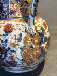 A Chinese English-decorated blue and white jug and cover, Kangxi