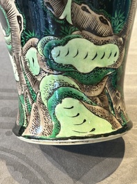 A Chinese famille verte black-ground vase and a pair of turquoise-glazed Buddhist lions, 19/20th C.