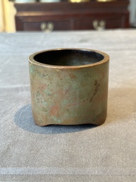 A small Chinese bronze cylindric tripod censer, Xuande mark, Ming
