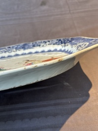 A Chinese famille rose 'He Xiangu' charger with a blue and white border, Qianlong