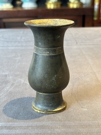 A rare Chinese parcel-gilt bronze ritual wine vessel, 'zhi 觯', Ming