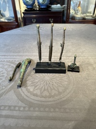 A varied collection of six Chinese bronze belt hooks, Warring States period and Western Han