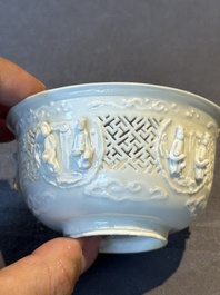 A pair of rare Chinese reticulated white-glazed biscuit 'Eight Immortals and Shoulao' bowls, Wanli