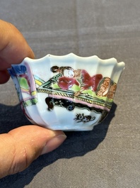 A Chinese famille rose cup and saucer with a reclined lady, Qianlong