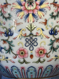 A pair of Chinese famille rose vases with floral design, Jiaqing mark, 19/20th C.