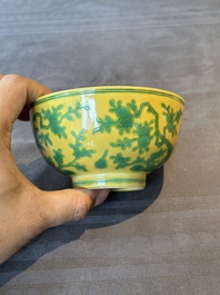 A pair of Chinese yellow-ground 'peach and bird' bowls, Qianlong mark and probably of the period