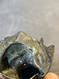 A small Chinese bronze figure of a Luohan, Ming