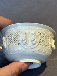 A pair of rare Chinese reticulated white-glazed biscuit 'Eight Immortals and Shoulao' bowls, Wanli