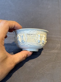 A pair of rare Chinese reticulated white-glazed biscuit 'Eight Immortals and Shoulao' bowls, Wanli