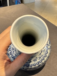 A Chinese blue and white 'lotus scroll' bottle vase, Transitional period