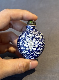 Two Chinese famille rose 'lotus scroll' snuff bottles and a flamb&eacute;-glazed snuff bottle, 19th C.