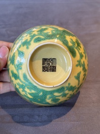 A pair of Chinese yellow-ground 'peach and bird' bowls, Qianlong mark and probably of the period