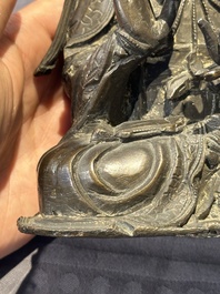 A Chinese bronze Guanyin, Ming and a Tibetan polychrome plaster relief, 19th C.