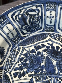 A Chinese blue and white kraak porcelain dish with flowers in a jardiniere, Wanli