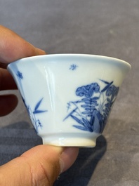 A Chinese blue and white 'erotic' cup and saucer, Kangxi