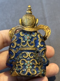 A Chinese gilt and champlev&eacute; enamelled bronze Bodhisattva on a carved stone stand, Qing