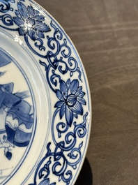 A pair of Chinese blue and white 'hunting scene' plates, Qi Yu Bao Ding Zhi Zhen 奇玉寶鼎之珍 mark, Kangxi