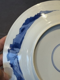 A pair of Chinese blue and white 'hunting scene' plates, Qi Yu Bao Ding Zhi Zhen 奇玉寶鼎之珍 mark, Kangxi