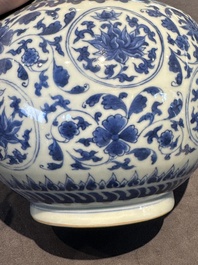 A Chinese blue and white 'lotus scroll' bottle vase, Transitional period