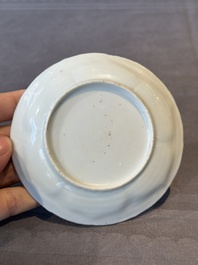 A Chinese famille rose cup and saucer with figures and animals, Yongzheng