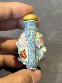 A Chinese moulded famille rose 'playing boys' snuff bottle, Qianlong mark, 19th C.