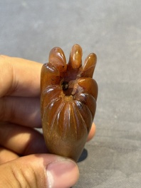 A rare Chinese rhinoceros horn snuff bottle in the shape of a Buddha hand, 19th C.