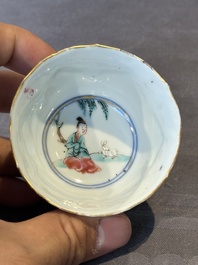 A Chinese famille rose cup and saucer with figures and animals, Yongzheng
