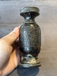 A Chinese bronze vase and a Taoist figure-shaped incense burner, Ming