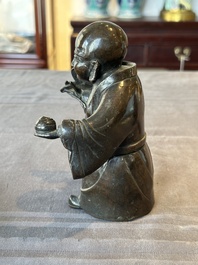 A Chinese bronze vase and a Taoist figure-shaped incense burner, Ming