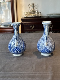 A pair of Chinese blue and white ewers with floral design, Kangxi