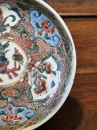Nine Chinese famille rose cups and eight saucers, Yongzheng/Qianlong