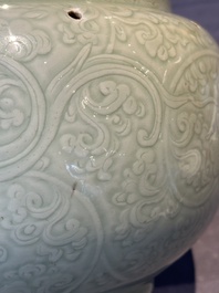 A Chinese monochrome celadon-glazed jar with anhua chilong and floral design, Kangxi