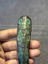 A varied collection of six Chinese bronze belt hooks, Warring States period and Western Han