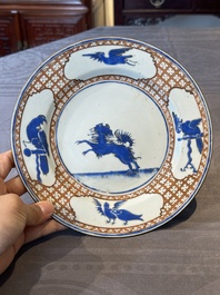 A pair of Chinese 'leaping pekinese' plates, possibly after a design by Cornelis Pronk, Qianlong, ca. 1740