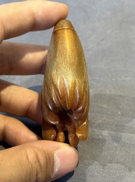 A rare Chinese rhinoceros horn snuff bottle in the shape of a Buddha hand, 19th C.