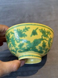 A pair of Chinese yellow-ground 'peach and bird' bowls, Qianlong mark and probably of the period