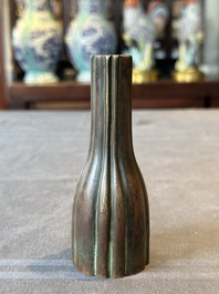 A rare Chinese ribbed bronze flower arranging vase, Ming