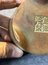 A small Chinese bronze cylindric tripod censer, Xuande mark, Ming