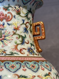 A pair of Chinese famille rose vases with floral design, Jiaqing mark, 19/20th C.