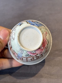 A Chinese famille rose cup and saucer with music making ladies, Yongzheng/Qianlong