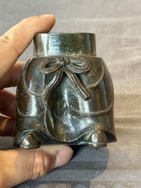 A Chinese bronze vase and a Taoist figure-shaped incense burner, Ming