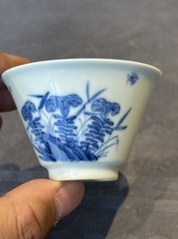 A Chinese blue and white 'erotic' cup and saucer, Kangxi